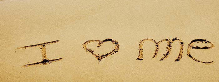 I Love Me inscrit dans le sable